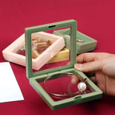 3D floating clear jewelry display box with necklace and ring inside