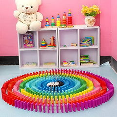 Child playing with 120 Pcs colorful wooden domino blocks set
