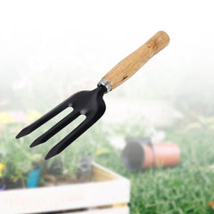 Side view of hand weeding fork with fixed handle