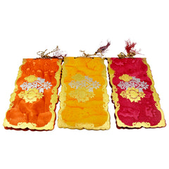 Detail of a single purse-style shagun envelope with elegant pattern.