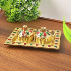 Close-up of pooja thali plate with traditional design
