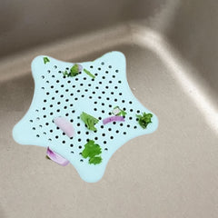 Silicone hair catcher placed on sink drain