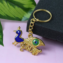Golden Krishna Peacock keychain with intricate design