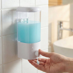 Manual liquid soap dispenser on wall