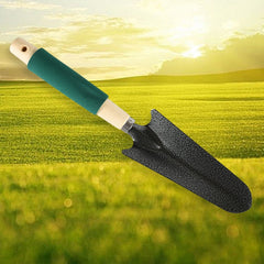 Hand cultivator with three prongs and a wooden handle