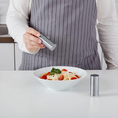 Close-up of stainless steel salt and pepper shaker set