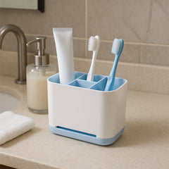 Side view of multi-use toothbrush caddy stand in bathroom setting