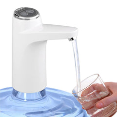 Portable USB electric water dispenser pump on wooden surface