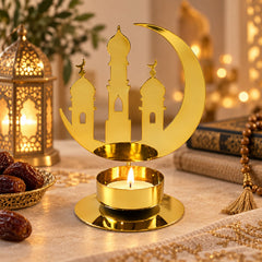 A golden metal crescent moon and mosque design incense holder with a lit tealight candle.