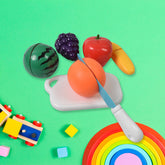 Kids playing with sliceable fruit toy set