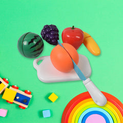 Kids playing with sliceable fruit toy set