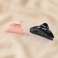 Hair claw clip showing spring-loaded claw grip mechanism