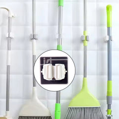 Single wall mounted mop holder securely holding a mop