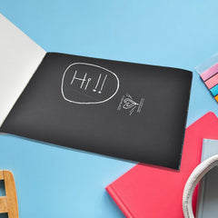 Child scratching colorful art sheet
