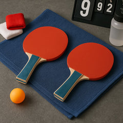 Two Konex table tennis paddles and orange balls on white background