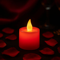 Single red plastic LED tea light diya, viewed from the top, highlighting its compact design.