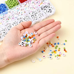 Open DIY bracelet kit showing alphabet beads & tools