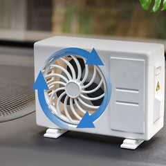 Car air freshener attached to AC vent