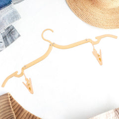 Adjustable fold hanger with clips