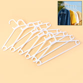 Set of 6 white plastic clothes hangers