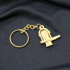Golden Shivling metal keychain showing size