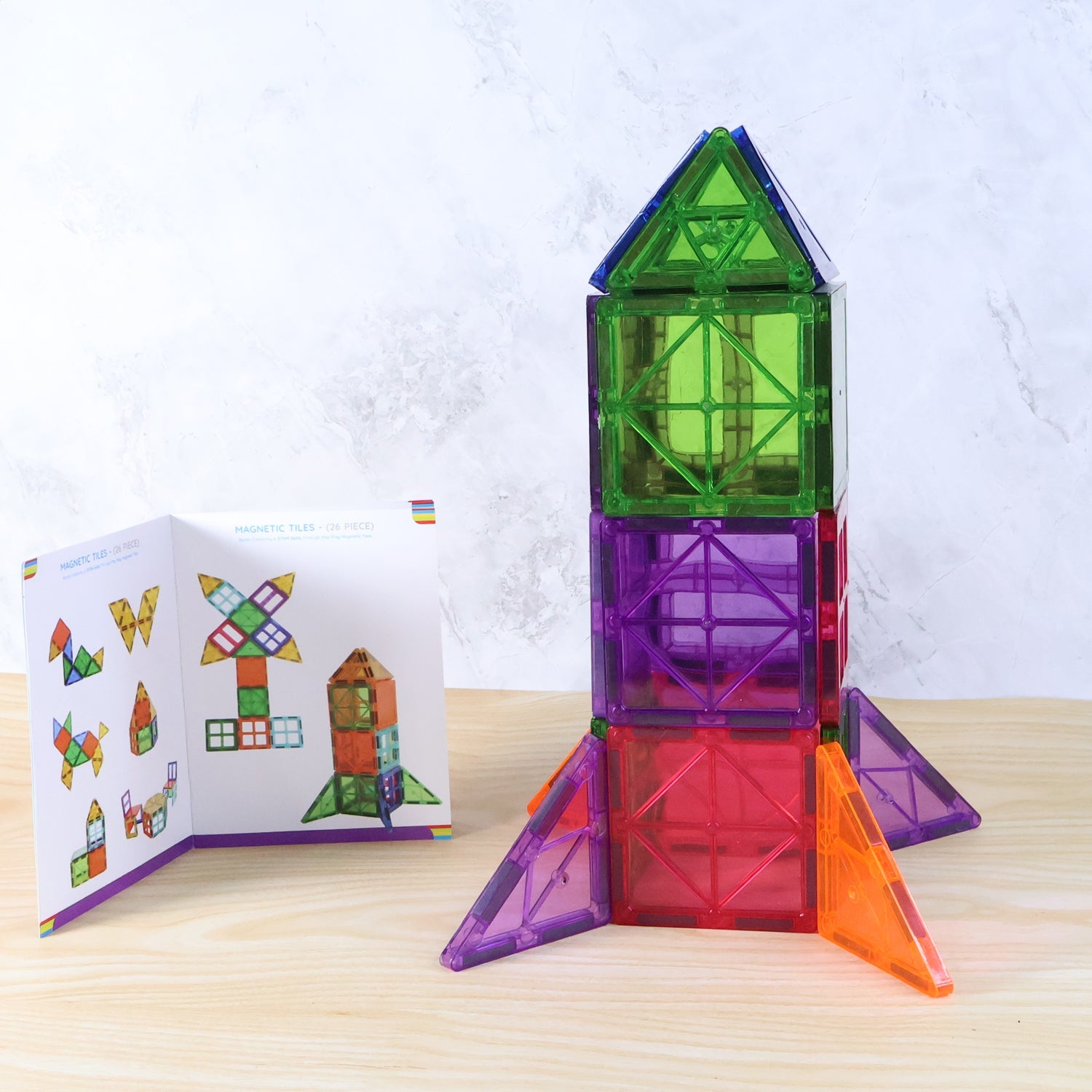 26-piece magnetic building tile set assembled into colorful shapes