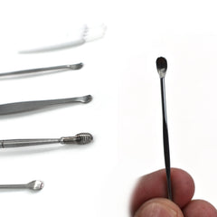 Earwax removal kit tools arranged on white background