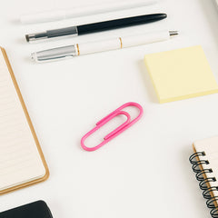 Colorful paper clips on white background