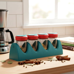 Hand holding a spice shaker from the 4-in-1 set