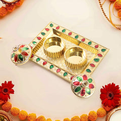 Plastic kumkum thali holder shown with haldi and kumkum