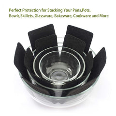 Pots and pans stacked with felt protectors between