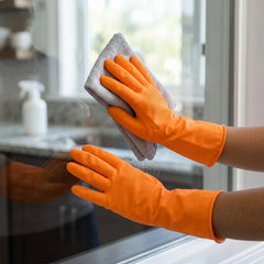 Close-up of orange medium cleaning gloves
