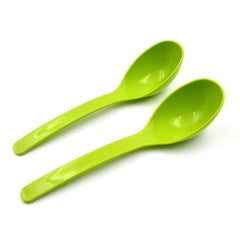 Two plastic kitchen ladles side by side on grey background