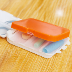 Open pill organizer showing compartments for tablets
