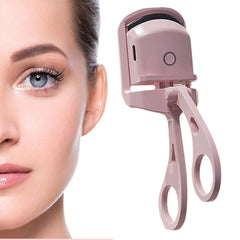 Long-lasting heated eyelash curler with protective silicone pad