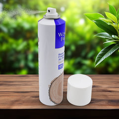 Air freshener spray bottle placed on wooden table