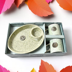 Ceramic cups filled with tea served on BPA-free plastic serving tray
