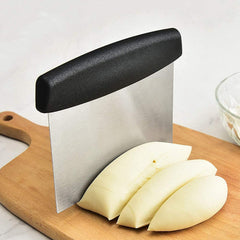 Using scraper to cut and fold dough