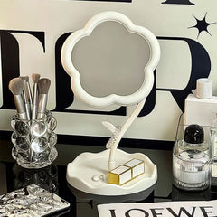 Flower-shaped desktop mirror adding aesthetic decor to a room