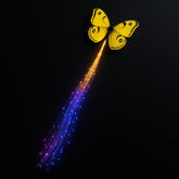 LED butterfly hair clip glowing in party light
