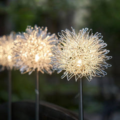 Solar LED Dandelion Lights glowing at night