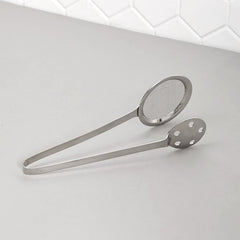 Polished steel serving tong with skimmer and perforated tong sides