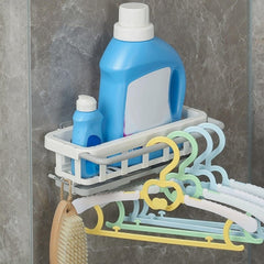 Close-up of sponges & brush in hanging sink organizer