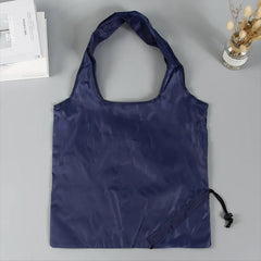 Reusable grocery bag folded for compact storage