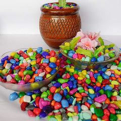 Vibrant decorative stones in a glass vase