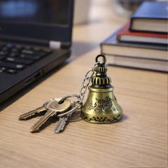 Detailed metal temple bell keychain hanging