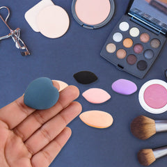 Multicolor Mini Finger Makeup Powder Puffs arranged on white background