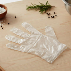 Transparent disposable gloves on hands