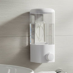 Lotion dispenser with manual push button