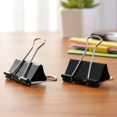 Metal arms of black binder clips